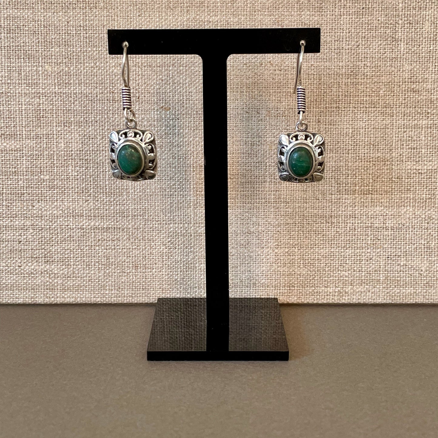 Fretwork Berber Silver Earrings with Oval green Stones on stand