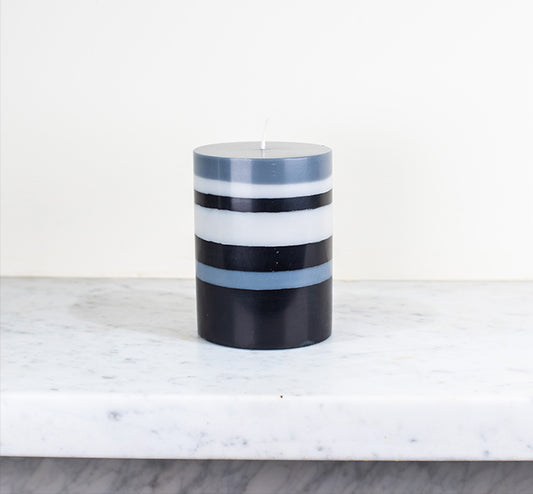 Eco Pillar Candle in Gull, Gunmetal and Jet Stripes on shelf